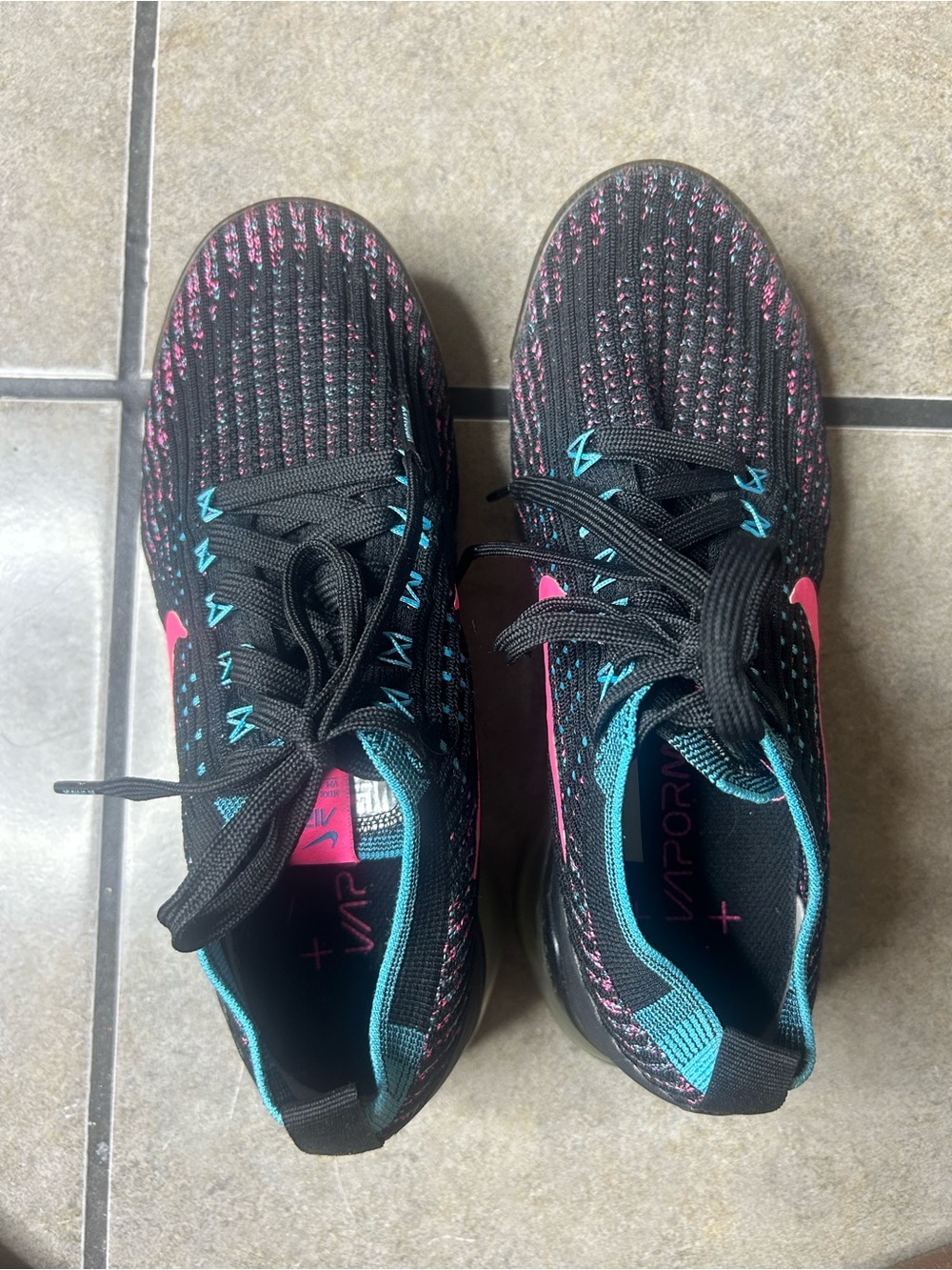 Nike Black Running Shoes with Pink and Teal Accents